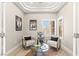 Charming sitting room features a unique tray ceiling and refined furnishings at 10557 Shoalhaven Dr, Las Vegas, NV 89134