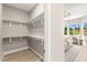Walk-in closet with ample shelving, hanging space, and open view to the bedroom at 10557 Shoalhaven Dr, Las Vegas, NV 89134