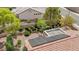 Aerial view of the property shows solar panels, tile roof, desert landscaping, and pool at 10709 Hunters Woods Pl, Las Vegas, NV 89134