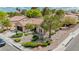 Aerial view of home displaying the beautiful desert landscaping, tile roof, and neighborhood setting at 10709 Hunters Woods Pl, Las Vegas, NV 89134