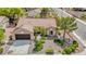 Aerial view of the home shows its well-maintained landscaping, tile roof, and location in a quiet neighborhood at 10709 Hunters Woods Pl, Las Vegas, NV 89134