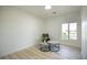 Bright, empty bedroom with light hardwood flooring and a window offering ample natural light at 10709 Hunters Woods Pl, Las Vegas, NV 89134