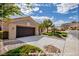 Charming single-story home boasts a well-maintained landscape and mountain views at 10709 Hunters Woods Pl, Las Vegas, NV 89134