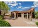 Exterior of house with tile roof and desert landscaping enhances this single-story property at 10709 Hunters Woods Pl, Las Vegas, NV 89134