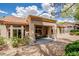 Back of house with a covered patio and desert landscaping offers comfortable outdoor living and backyard views at 10709 Hunters Woods Pl, Las Vegas, NV 89134