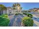 Single story home featuring gravel landscaping, mature trees, bushes, and privacy fence at 10709 Hunters Woods Pl, Las Vegas, NV 89134