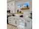 Well-lit kitchen showcasing modern countertops, stylish shelving, and ample storage space at 10709 Hunters Woods Pl, Las Vegas, NV 89134