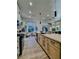Bright kitchen featuring a large island, modern appliances, and a charming breakfast nook at 10709 Hunters Woods Pl, Las Vegas, NV 89134