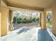 Cozy covered patio with open views of the landscaped backyard, perfect for relaxing at 10709 Hunters Woods Pl, Las Vegas, NV 89134