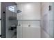 Sleek walk-in shower features glass partition, rainfall shower head, and built-in shelving at 10709 Hunters Woods Pl, Las Vegas, NV 89134