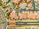 Captivating aerial view of a neighborhood with manicured lawns, perfectly arranged trees, and well-maintained streets at 10809 Garden Mist Dr # 1004, Las Vegas, NV 89135