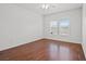 Bright bedroom featuring hardwood floors and natural light at 10809 Garden Mist Dr # 1004, Las Vegas, NV 89135
