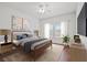 Cozy bedroom with natural light, stylish decor, and a comfortable queen-sized bed at 10809 Garden Mist Dr # 1004, Las Vegas, NV 89135