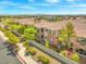Beautiful townhome featuring a red tile roof, multiple balconies, and mature landscaping in a well-maintained community at 10809 Garden Mist Dr # 1004, Las Vegas, NV 89135