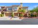 Modern two-story townhouse with an attached two car garage and manicured landscaping at 10809 Garden Mist Dr # 1004, Las Vegas, NV 89135