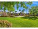 Expansive green space showcasing lush lawns, mature trees, and community pool promoting outdoor recreation and relaxation at 10809 Garden Mist Dr # 1004, Las Vegas, NV 89135