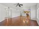 Spacious living room with hardwood floors and a ceiling fan at 10809 Garden Mist Dr # 1004, Las Vegas, NV 89135