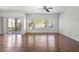Spacious living room featuring hardwood floors, natural light and a patio at 10809 Garden Mist Dr # 1004, Las Vegas, NV 89135