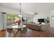 Bright living room featuring hardwood floors, contemporary decor and sliding glass doors to the exterior at 10809 Garden Mist Dr # 1004, Las Vegas, NV 89135