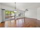 Open living room with hardwood floors and access to the patio at 10809 Garden Mist Dr # 1004, Las Vegas, NV 89135