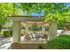 Outdoor pavilion featuring dining tables, ceiling fan and a grill, perfect for hosting gatherings or enjoying al fresco dining at 10809 Garden Mist Dr # 1004, Las Vegas, NV 89135