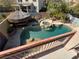Bird's eye view of a backyard oasis featuring a pool, spa, and gazebo at 1105 Enderly Ln, Las Vegas, NV 89144