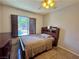 Cozy bedroom with a warm inviting atmosphere, complete with a backyard view at 1105 Enderly Ln, Las Vegas, NV 89144