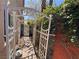 Charming garden path featuring a white trellis and lush greenery, creating a serene and inviting outdoor space at 1105 Enderly Ln, Las Vegas, NV 89144