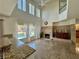 Spacious living room featuring a fireplace, tile flooring, and backyard pool views at 1105 Enderly Ln, Las Vegas, NV 89144