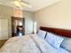 Comfortable main bedroom showcasing soft natural light, neutral color palette, and an en-suite bathroom at 1105 Enderly Ln, Las Vegas, NV 89144