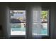 View of the inviting pool from inside the home through sheer-curtained windows at 1105 Enderly Ln, Las Vegas, NV 89144
