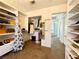 Well-organized walk-in closet showcasing ample space for clothing and accessories at 1105 Enderly Ln, Las Vegas, NV 89144