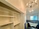 Large walk-in closet with extensive shelving, leading to the en-suite bathroom at 1105 Enderly Ln, Las Vegas, NV 89144