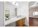 A bright bathroom with a white marble countertop vanity, providing a clean and modern aesthetic at 11079 Zampino St, Las Vegas, NV 89141