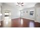 A bright room with dark wood floors and ample natural light, ready for personalization at 11079 Zampino St, Las Vegas, NV 89141
