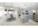 Charming kitchen with blue cabinets, stainless steel appliances, and island seating at 11079 Zampino St, Las Vegas, NV 89141