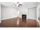 Spacious living room features fireplace, ceiling fan, and stylish wood floors at 11079 Zampino St, Las Vegas, NV 89141