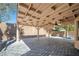 The covered patio has exposed rafters and a stone paver floor at 11079 Zampino St, Las Vegas, NV 89141
