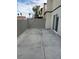 A small backyard with a concrete patio and block wall at 1203 Mews Ln, Las Vegas, NV 89101