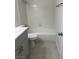 Clean bathroom features gray cabinets, white marble-look countertops and tile in the tub/shower at 1203 Mews Ln, Las Vegas, NV 89101