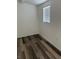 This bedroom features wood floors and a window allowing ample light at 1203 Mews Ln, Las Vegas, NV 89101