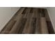 Close up view of the wood look flooring with white trim at 1203 Mews Ln, Las Vegas, NV 89101