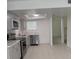 Beautiful, updated kitchen boasts stainless appliances, stone countertops, and stylish gray cabinets at 1203 Mews Ln, Las Vegas, NV 89101