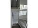 Angle view of white staircase featuring a window view at 1203 Mews Ln, Las Vegas, NV 89101