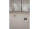Close up of wall with white cabinets, outlets, and water connection at 1203 Mews Ln, Las Vegas, NV 89101