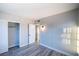 Bright bedroom features updated flooring, neutral paint, and an open closet for ample storage at 170 Copper St, Henderson, NV 89015