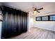 Modern bedroom features new wood floors, windows and lighting at 170 Copper St, Henderson, NV 89015