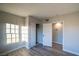 Bedroom boasts gray wood-look floors, closet, and a neutral color scheme at 170 Copper St, Henderson, NV 89015