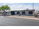 Charming single-story home featuring gray siding, red shutters, and low-maintenance gravel landscaping at 170 Copper St, Henderson, NV 89015