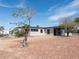 Exterior of single-story home featuring carport, neutral color palette and desert landscaping at 170 Copper St, Henderson, NV 89015